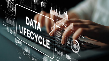 Hands Typing on Keyboard with Data Lifecycle Concept Illustrations and Digital Graphics on Screen Background. Asymptotic smart data analytic.の写真素材