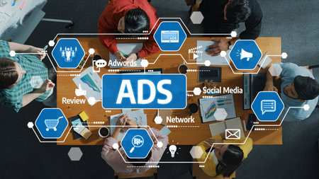 A diverse team collaborates in a modern workspace, focusing on advertising strategies and digital marketing solutions, using technology and analytics for effective campaigns. Amityの写真素材