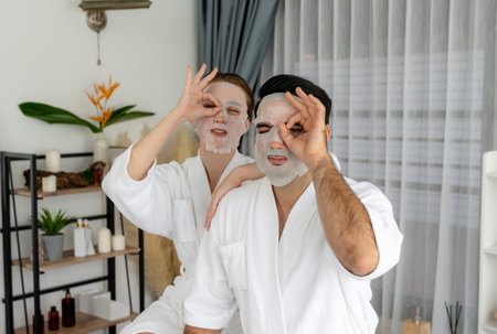 Serene modern daylight ambiance of spa salon, couple customer indulges in rejuvenating with facial skincare mask. Facial skin treatment and beauty cosmetology procedure for face. Quiescentの写真素材