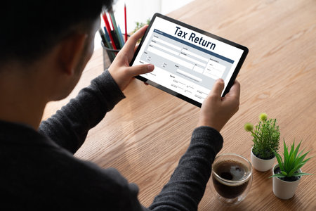 Online tax return form for submitting individual income tax return form snugly on the internet website. Government web for tax payment and return. Taxation technology concept.の写真素材