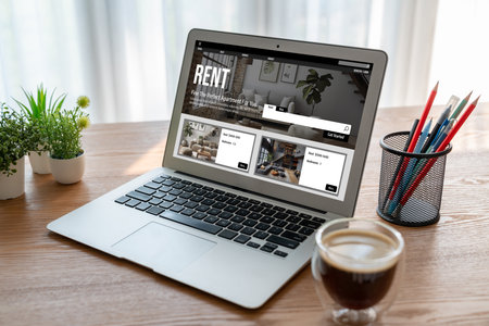 Online real estate rental search snugly on computer. House home or apartment rental website online.の写真素材