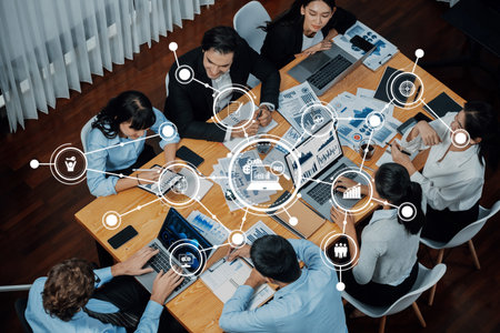 A diverse team of professionals collaborates in a modern office setting, surrounded by technology...