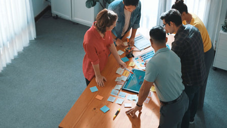 Time lapse of manager writing idea on sticky note and explain idea about web design. Professional...