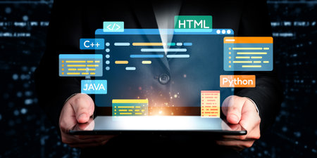 Software developer or programmer work with coding digital overlays of various programming languages like HTML, and C++ for new application mobile phone developmentの写真素材
