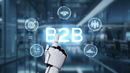 A robotic hand points at a glowing B2B symbol amid modern office graphics. This image depicts the integration of technology and innovation in business environments.の写真素材