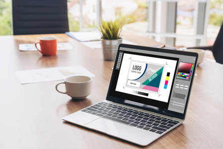 Graphic designer software for modern design of web page and commercial ads showing on the computer...