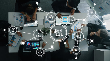 A dynamic business meeting showcasing collaboration among professionals, featuring data...