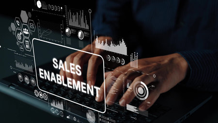 Hands Typing on Laptop with Digital Sales Enablement Concept and Data Graphics Overlay in Modern Office Environment. Asymptotic smart data analytic.の写真素材