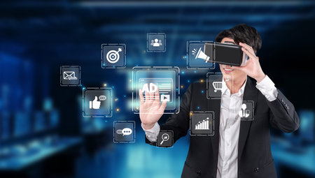 A young businessman interacts with virtual reality advertisements in a high-tech environment, showcasing the integration of innovative technology in digital marketing strategies.の写真素材