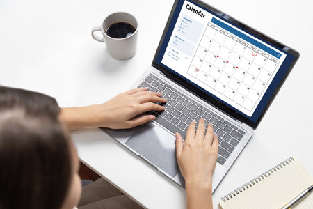 Calendar on computer software application for brisk schedule planning for personal organizer and online businessの写真素材