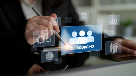 Outsourcing concept showing collaboration, delegation, global workforce, productivity, and task management through remote teams and external service providersの写真素材