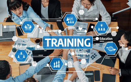 A diverse group of professionals engaged in training and development activities using modern technology and visual tools, showcasing teamwork and collaboration in a vibrant workspace.の写真素材