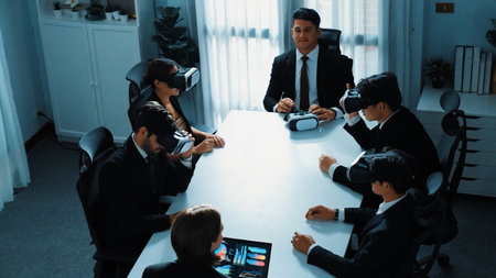 Top view of project manager working on laptop and sending data analysis to business people by using VR glass headset. Professional marketing team enter metadata or virtual world program. Directorate.の写真素材