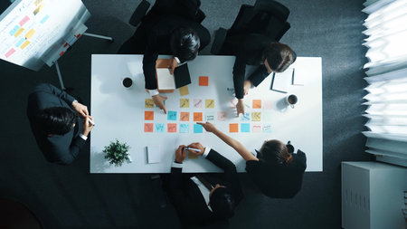 Time lapse of business people brainstorm and share business idea. Top down aerial view of businessman writing marketing strategy on whiteboard while explain plan to executive manager. Directorate.の写真素材