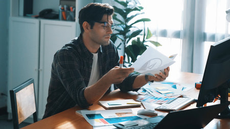 Professional designer writing and designing logo graphic at meeting. Closeup of business man working...