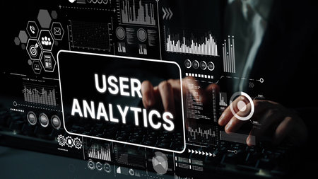 Hands Typing on Keyboard with User Analytics Data Visualization and Graphs on Screen in Modern Office Environment. Asymptotic smart data analytic.の写真素材