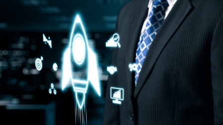 A business professional stands in a modern office, surrounded by futuristic icons representing rocket launches and growth, emphasizing innovation and success in technology.の写真素材