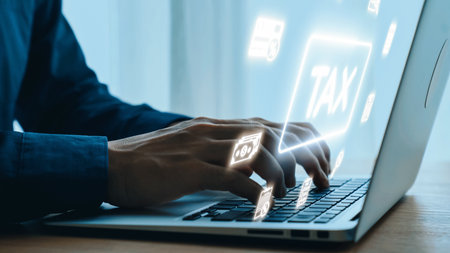 Hands Typing on Laptop with Digital Tax Icons Above, Representing Online Tax Management, Financial Planning, and Digital Solutions for Tax Filing. Qubit.の写真素材