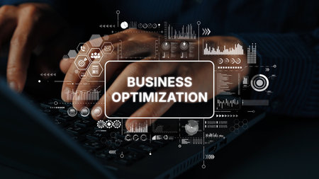 Hands Typing on a Keyboard with Business Optimization Graphics and Data Analytics Overlays in a Modern Office Setting. Asymptotic smart data analytic.の写真素材