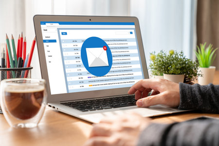 Email notification message showing on computer screen snugly. Digital marketing message information text from business to customer clientの写真素材