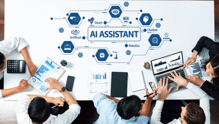 A top-down view of a collaborative meeting discussing the impact of AI assistants on business, featuring laptops, tablets, and analytics on a modern workspace. Amityの写真素材