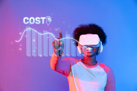 A young individual experiences virtual reality while interacting with a cost reduction graph, showcasing innovative insights and modern financial analysis concepts.の写真素材