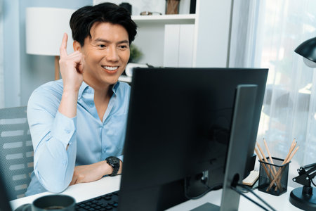 Portrait successful smart businessman working computer with successful business in database marketing, getting project from customer in at modern office in making startup business concept. Infobahn.の写真素材