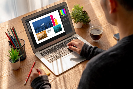 Graphic designer software for modern design of web page and commercial ads showing on the computer screenの写真素材