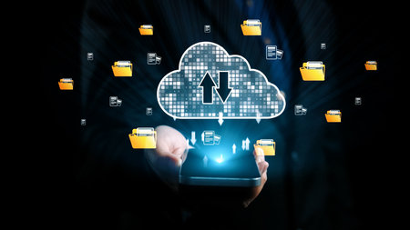 A modern smartphone held by hands displays a cloud computing concept with digital data transfer...