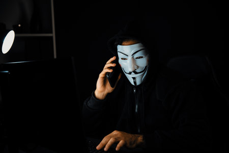White smiling criminal anonymous mask calling to victim, convince to hack personal information,...
