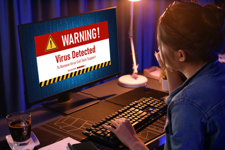 Virus warning alert on computer screen detected brisk cyber threat , hacker, computer virus and...