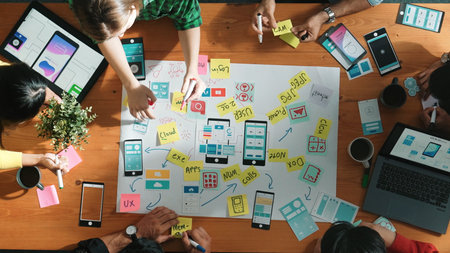 Professional developer team sharing idea of Ux Ui design by using mind map. Top down view of group...