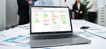 Project planning software for brisk business project management on the computer screen showing...