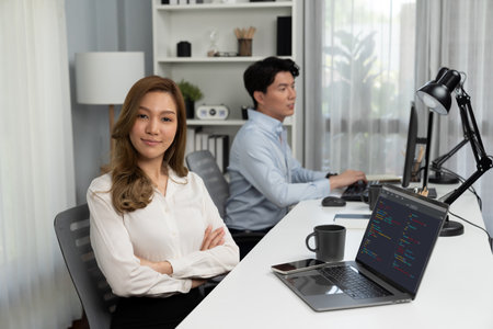 Profile smiling beautiful Asian businesswoman looking camera to portrait pose at modern office on...