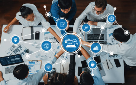 A diverse group of professionals engaged in a dynamic business meeting focused on data analysis and...