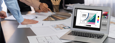 Group of interior architect designer discussing together on blueprint and laptop screen display...