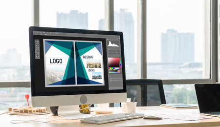 Graphic designer software for modern design of web page and commercial ads showing on the computer...