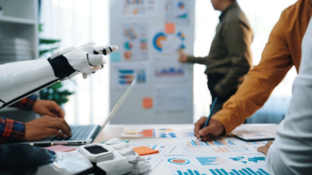 A modern office scene depicting a robot hand assisting professionals with data analysis and...