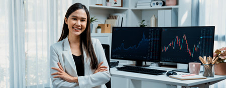 Profile of young Asian businesswoman smiling on happy face with white suit sitting chair against...