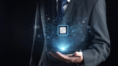 A businessman in a suit is using a smartphone that features a glowing digital circuit and chip...