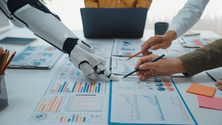 A futuristic scene depicting a collaboration between a human hand and a robotic arm over business...