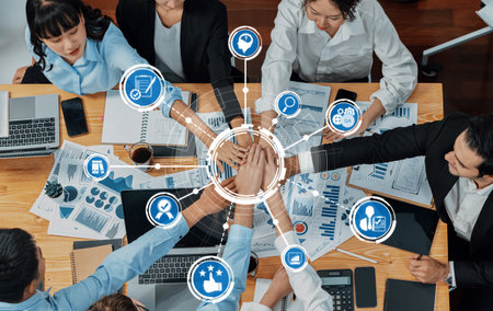 A diverse group of professionals actively engaged in a business meeting, showcasing teamwork,...