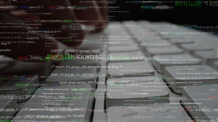 A close-up view of hands on a keyboard, with programming code overlaying the surface, capturing the...