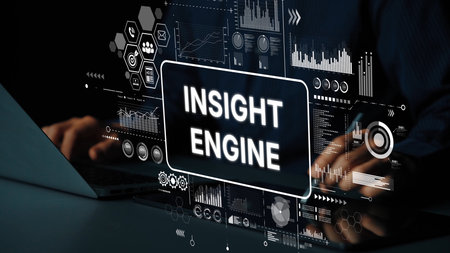 Hands Typing on Laptop with User Interface Elements Highlighting Insight Engine Technology and Data...