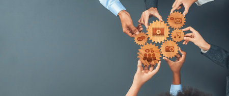 Diverse hands creatively unite around gear icons representing digital media and communication,...