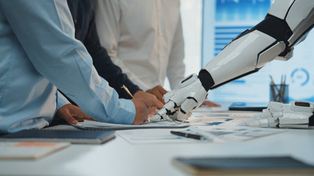 An engaging scene of collaboration in a modern office where human hands and a robot arm work...