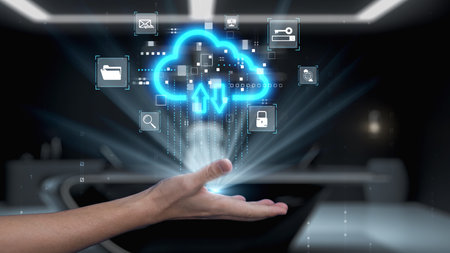 A futuristic hand reaches out towards glowing cloud icons, representing data transfer and cloud...