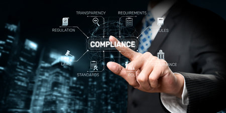 A businessman wearing a suit is interacting with a digital compliance concept. This image highlights...