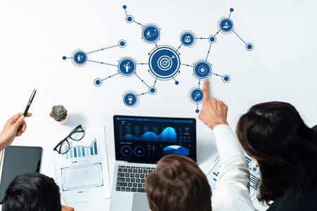 A modern office scene showcasing a collaborative team discussing business strategy and analytics...