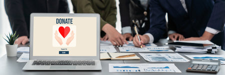 Panorama shot analyst team utilizing BI Fintech to analyze financial report with laptop. Businesspeople analyzing BI data dashboard displayed on laptop screen for business insight. Prodigyの写真素材